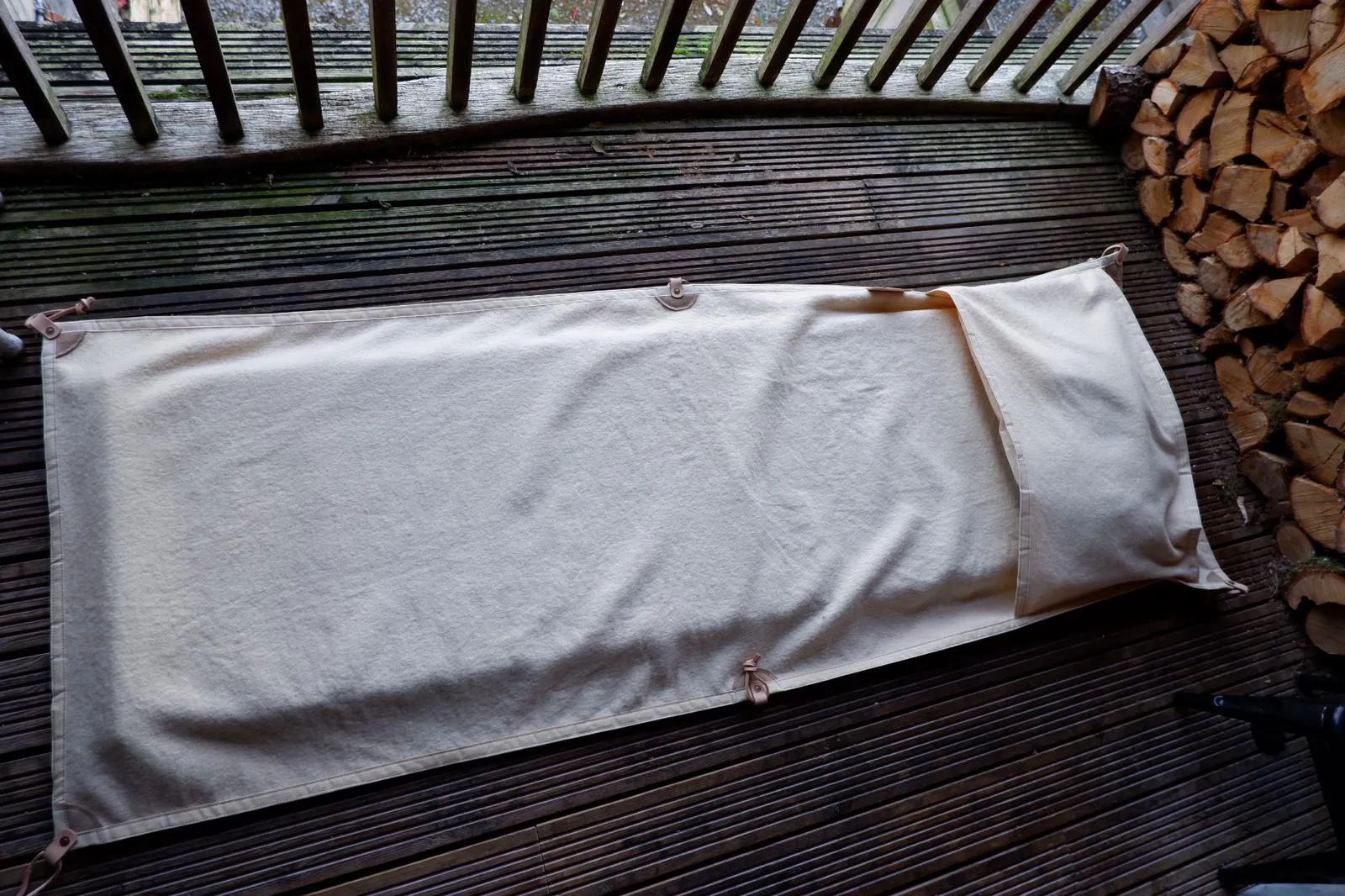 Sleeping mat cover, waxed-canvas-backed wool with leather tie-outs